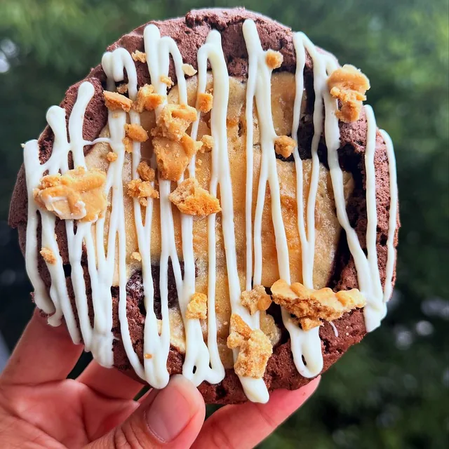 Double Choc Peanut Butter cookie — fudgy brownie base loaded with peanut butter.